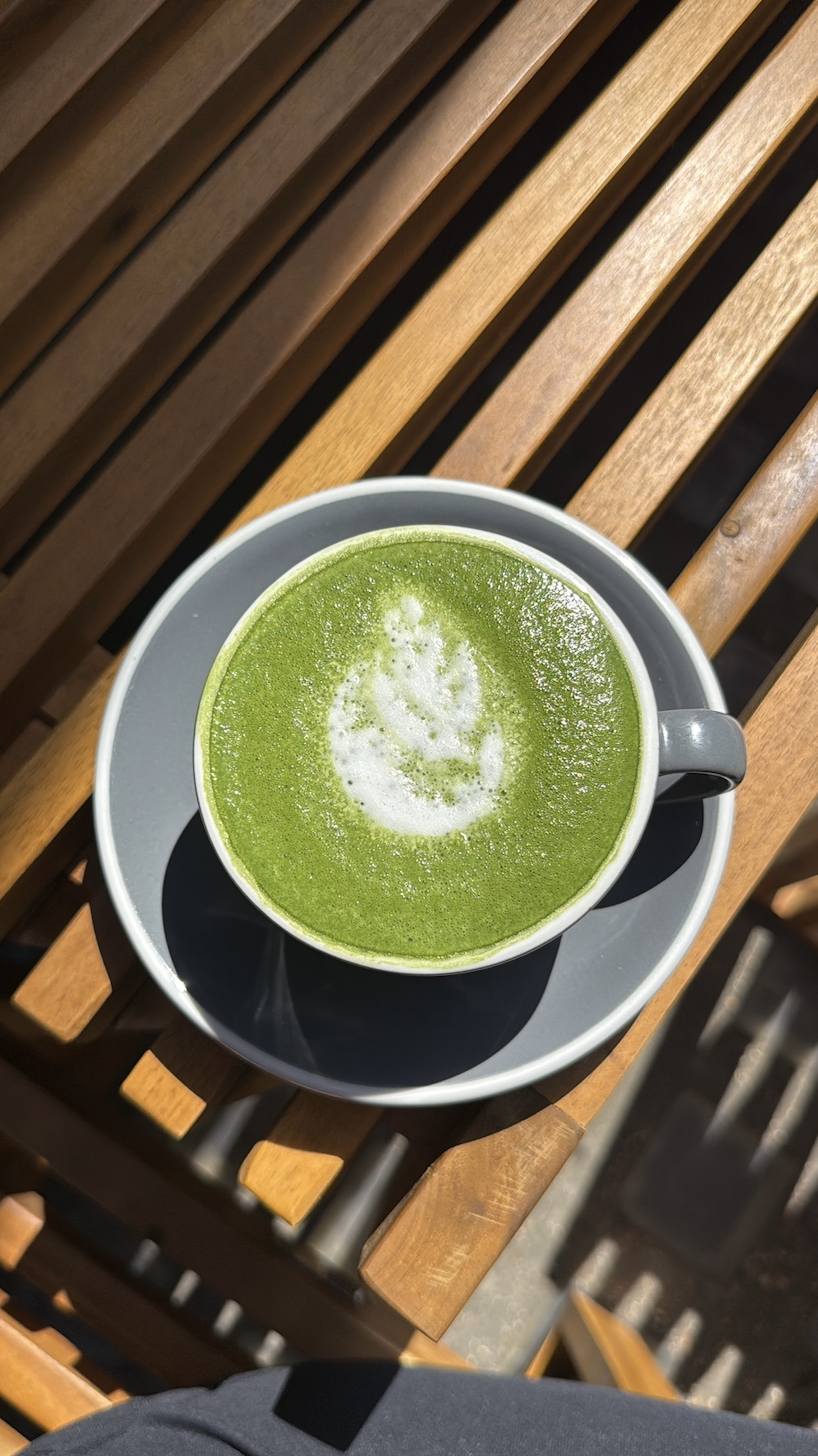 Matcha latte on wooden slats